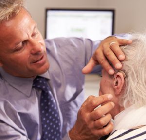 Doctor Checking Patients Hearing